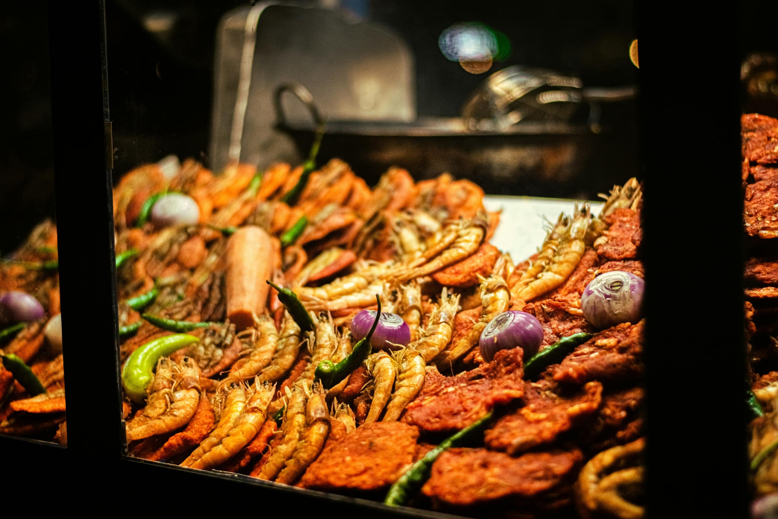 Sri Lankan street food being prepared on a hot griddle